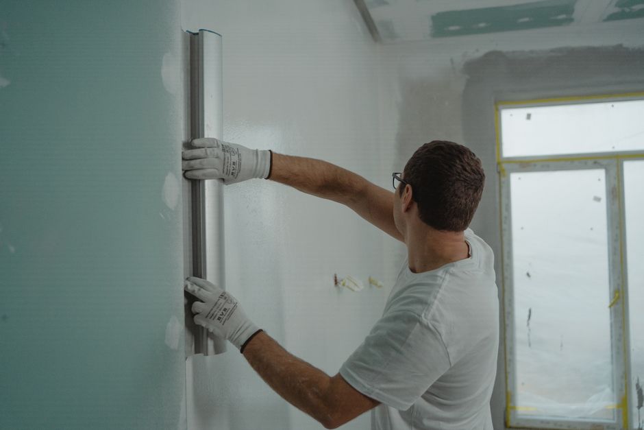 Kitchen remodeling contractor working on cabinets